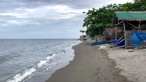 Small warm waves on the sandy shore of the sea gently stroke the shore Stock Footage 238578493