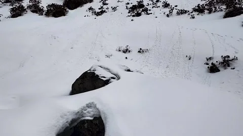 A small water cascade under frozen lake. Dharamshala Himachal Pradesh. Stock Footage 305193329