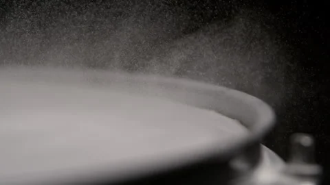 Small Water Drops Lifts Off Drum in Slow Motion Stock Footage 270409192