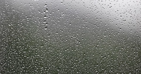 Small water drops on window on a rainy day Vídeo Stock 231901685