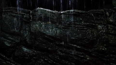 Small water fall over a Rocks Stock Footage 113544396