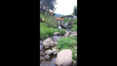 A small water fall under a bridge Stock Footage 271122957