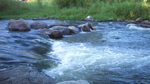 Small water rapid in river stream Stock Footage 133548189