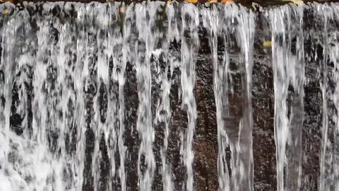 Small waterfal on a dam Stock Footage 83527889