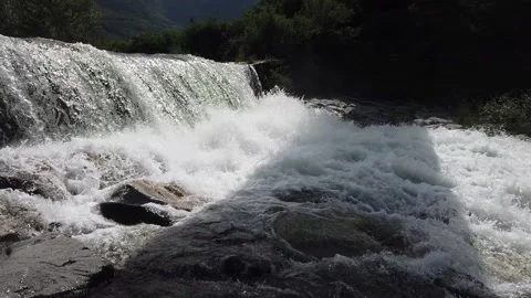 Small waterfall in the Alps Video stock 147947476