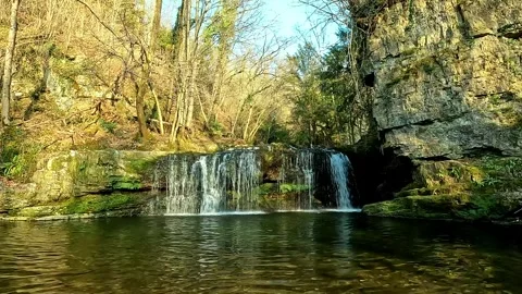 Small waterfall in the Alps of Lombardy Stock Footage 311206703