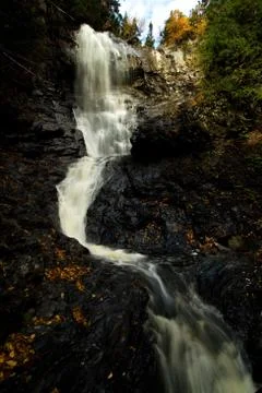 A small waterfall among the forest Stock Photos