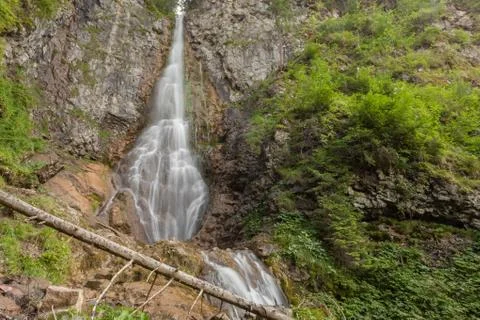 Small waterfall among the forest Stock Photos