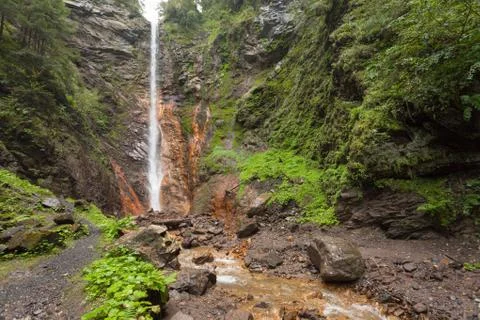 Small waterfall among the forest in val di Funes Stock-Fotos