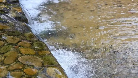 Small waterfall and clear water Stock Footage 78130982