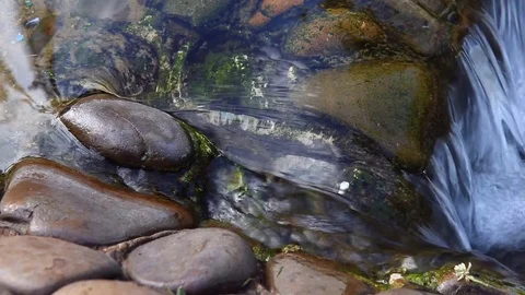 Small waterfall and clear water Stock Footage 78133493