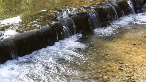 Small waterfall and clear water Stock Footage 78133531