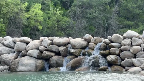 Small waterfall and mountain river in the forest. azure water. Stock Footage 307760457
