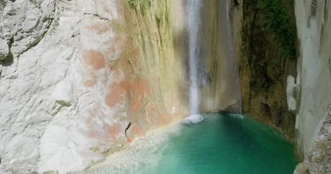 Small waterfall and natural pool with blue water. Stock-Footage 156416890