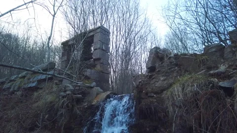 Small Waterfall and Old Ruins in Forest – Ancient Stone Structure 4K Video stock 329917922