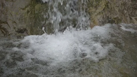 Small Waterfall and Rocks in a Mountain Landscape Video stock 83933998