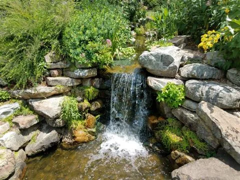 Small waterfall and rocks Stock Photos