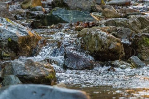 A small waterfall and rocks Stock Photos