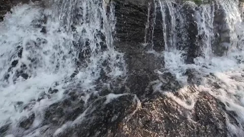 Small Waterfall and Rocky River Flow in Natural Forest Stream 4K Stock Footage 337309432