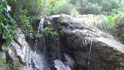 Small waterfall and a small lake in Jijel Stock Footage 129765033