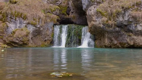 Small waterfall in the autumn forest Stock Footage 143389515
