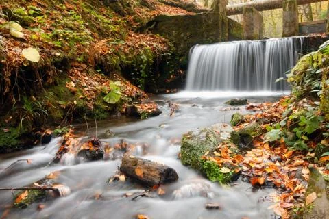 Small waterfall in autumn 스톡 사진