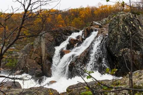 A small waterfall in autumn Stock Photos