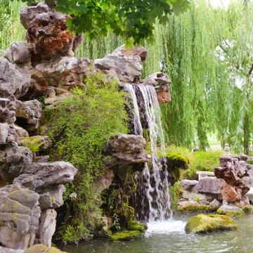 Small waterfall in beautiful park Stock Photos