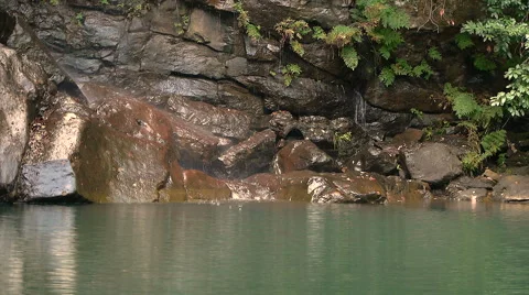 Small waterfall between rocks Stock Footage 43238909