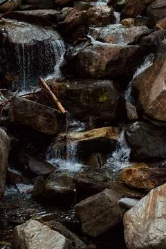 A small waterfall between the rocks. Stock Photos