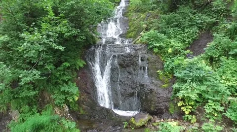 A small waterfall, camera movement back (quadrocopter) Stock Footage 65935610