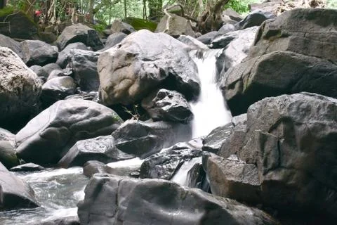 Small waterfall captured by increasing shutter speed Stock Photos