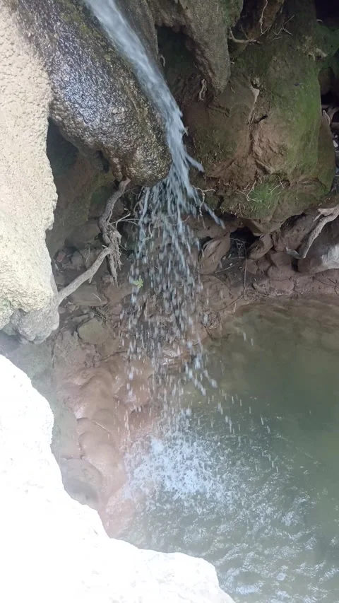 Small Waterfall Cascading Into Natural Pond 動画素材 340397851