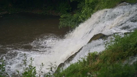 Small Waterfall Cascading over Rocks in Tropical Forest. Slow motion Stock Footage 92445766
