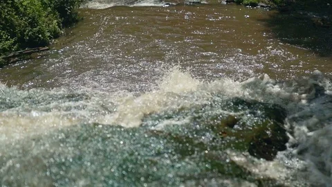 Small Waterfall Cascading over Rocks in Tropical Forest. Slow motion Stock Footage 92510968