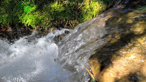 Small waterfall that causes foam Stock Footage 124367085