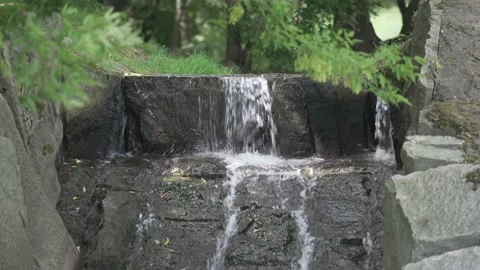 Small waterfall in the city park Stock-Footage 137653411