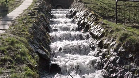 Small waterfall in the city park Stock Footage 304681896