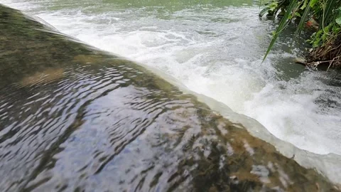 Small Waterfall at Code River, Yogyakarta Stock Footage 320613066