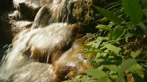 Small waterfall in a creek Stock Footage 104933002