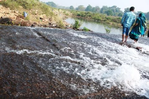Small waterfall at a dam Stock Photos