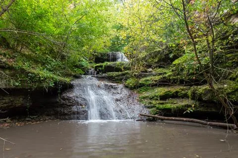 A small waterfall in early spring Stock Photos