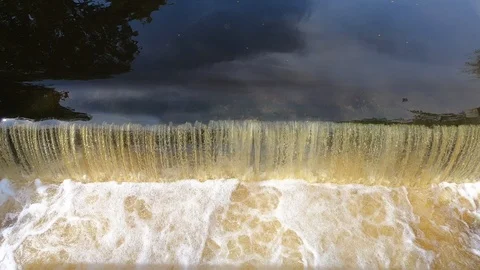 A small waterfall. The fall of water close-up. (with sound) Video stock 93298977