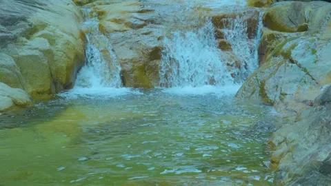 Small Waterfall Flowing into a Calm Pool | Relaxing Nature Sounds for Serenity Stock Footage 286937295