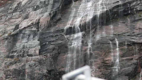 Small Waterfall Flowing Down Rocky Cliff Near Ilulissat Greenland 스톡 동영상 345558040