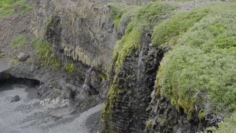 Small Waterfall Flowing Over Rocks on Disko Island Stock Footage 293019010