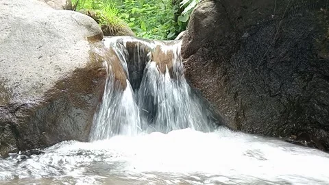 Small Waterfall Flowing Over Rocks Forest Natural Scene Stock Footage 330581867