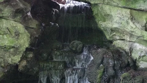 Small Waterfall Flowing Through Rocks with Natural Audio in Reims, France Video stock 335143699