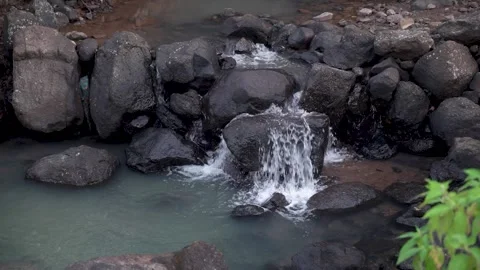 Small Waterfall Flowing Through Rocky Stream Stock Footage 345646805
