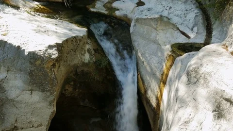 Small waterfall in a forest - 4K Stock Footage 79639471